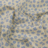 Cotton Poplin with Sky Blue Flower on a Beige Background - Maison Klem