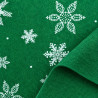Fieltro verde con motivos de copos de nieve blancos